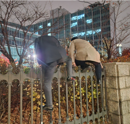 Member of Parliament Crossing the Parliament Wall Blocked by Police